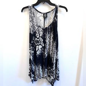 Soft knit tank with jagged edges at the bottom